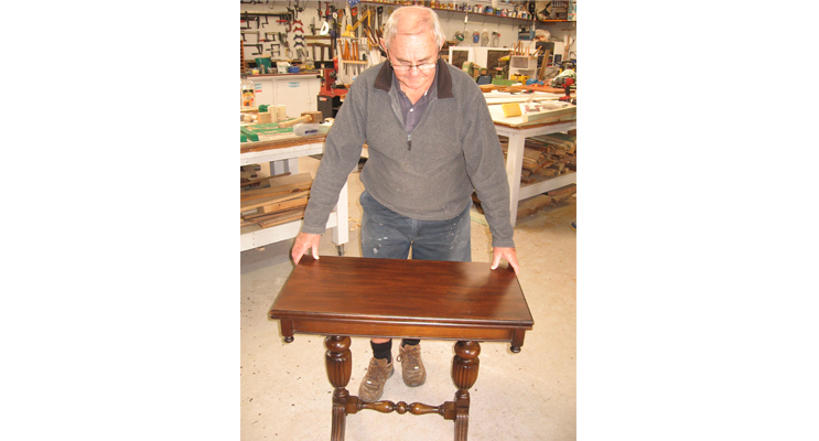 Col with his restored antique table.