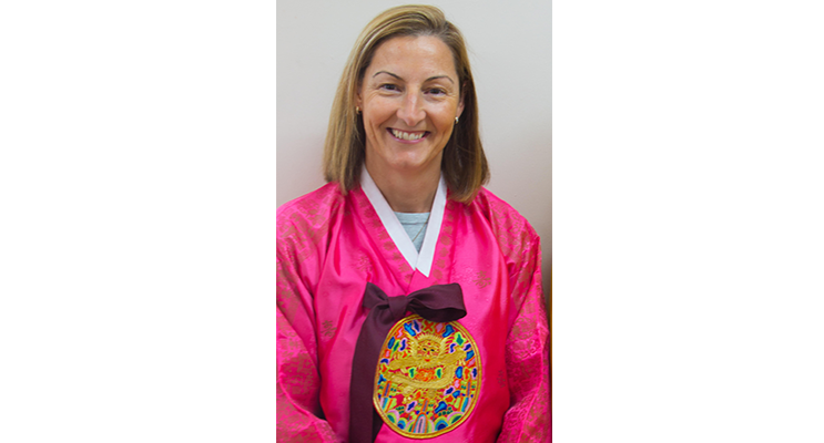 Principal Miss Young in traditional South Korean dress. 