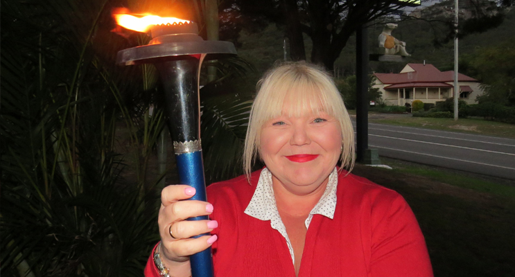 Darrelyn Perry with the Peace Torch in Bulahdelah.
