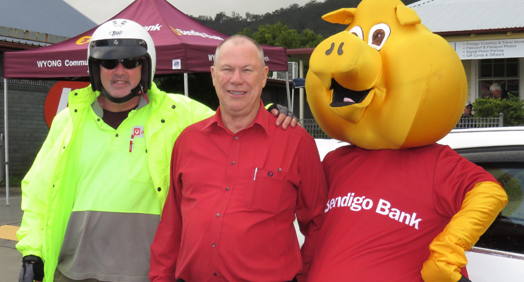 Postman Dave Burns, Roger Dixon and Piggy the Mascot.
