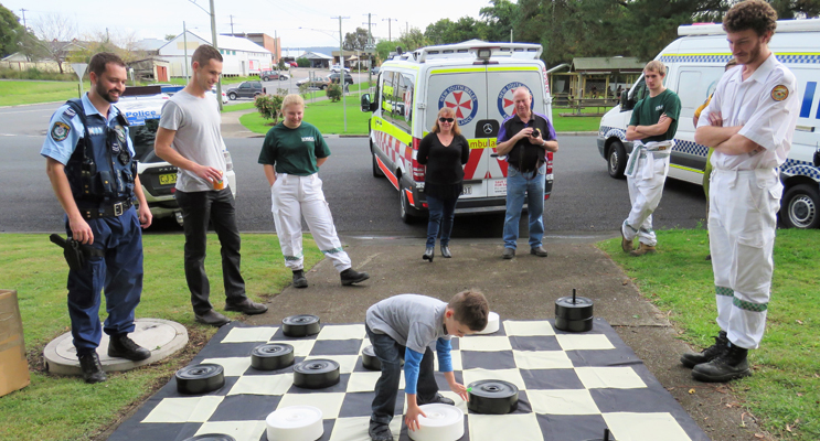 Andy Feeney enjoys a game of draughts on the giant board.
