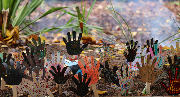 Hands painted in traditional painting styles adorned the Cultural garden for the official opening. 