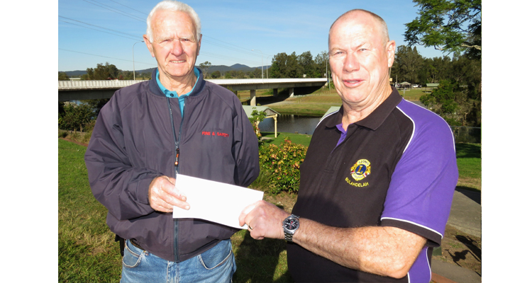 Roger Dixon accepts a donation on behalf of the Bulahdelah Activity Park Committee from Hunting Club Treasurer, Greg Russell.