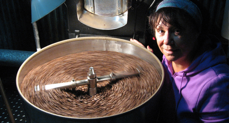 Jacqui with freshly roasted coffee beans at her Lemon Tree Passage headquarters. 