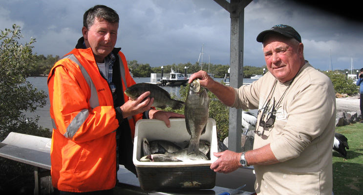 Craig and Max display their catch. 