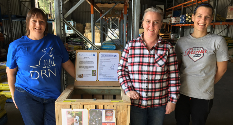 Jodi Deamer presents the new bin to Kerrie Anderson and Sarah Thurgar at the Medowie Pet Shed. 