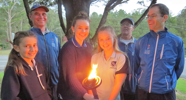 Carol Poniris, Molly Perry and Annee Perry with the Peace Runners in Bulahdelah. 
