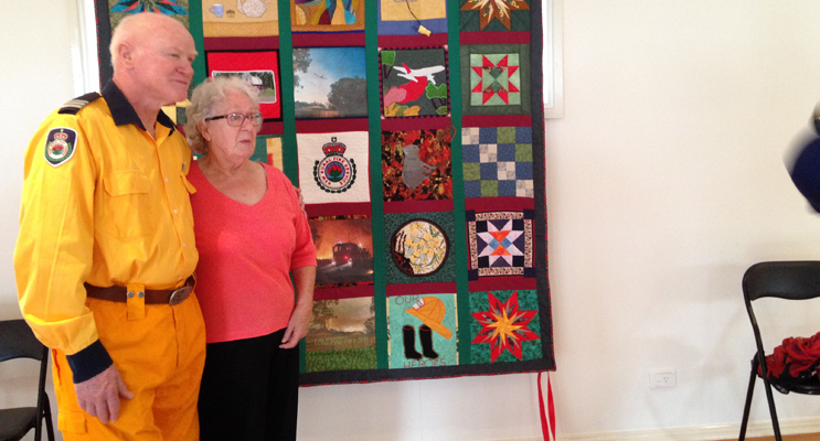 QUILT UNVEILED: Captain Ken Smee and Joyce Armstrong.