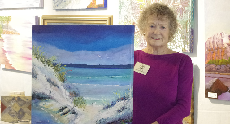 Margaret Watson with one of her works which she has donated to the Port Stephens Community Arts Centre as a raffle prize.  Photo by Marian Sampson.
