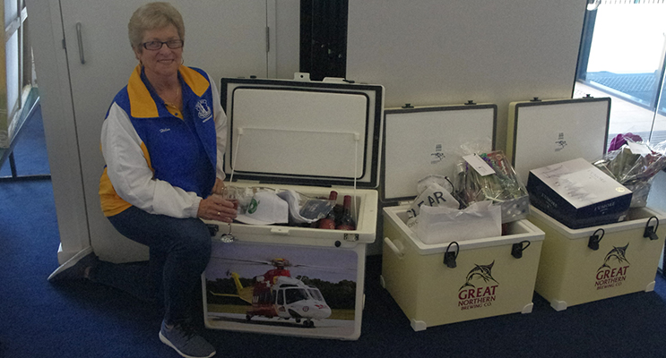 Helen Scott shows off the amazing prizes. Photo by Marian Sampson