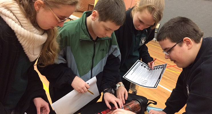 Students analysing data at the forensics workshop.