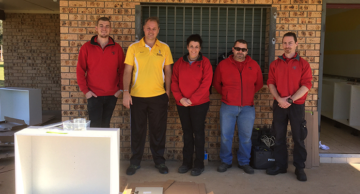 Little athletics volunteers and Bunnings staff installing the new kitchen: Jye Collinson, Jason Walls president, Margaret Webb, Drew Walker and Damian Meany.