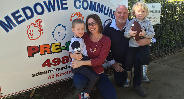 President Jacqui Hrast and Councillor and Deputy Mayor Chris Doohan outside Medowie Community Preschool with students Elliot and Xavier.