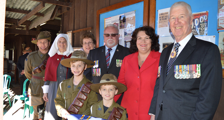 Jason and Renae Jenkins, Yvonne Fletcher, John Gillam, Meryl Swanson MP, and Air Vice Marshall Bob Treloar OAM (ret’d) with Michael (year 4) and Lachlan (year 2) holding the original medals.