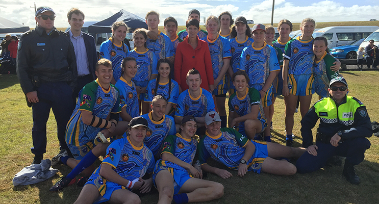 Girls and Boys Worimi team mates gather for a photo with local police and politicians.