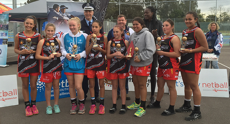 Netball tournament winners Awabakal receiving their trophies.