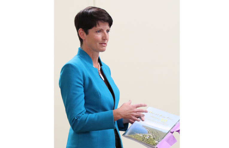 Kate Washington, MP, launching the book on North Arm Cove