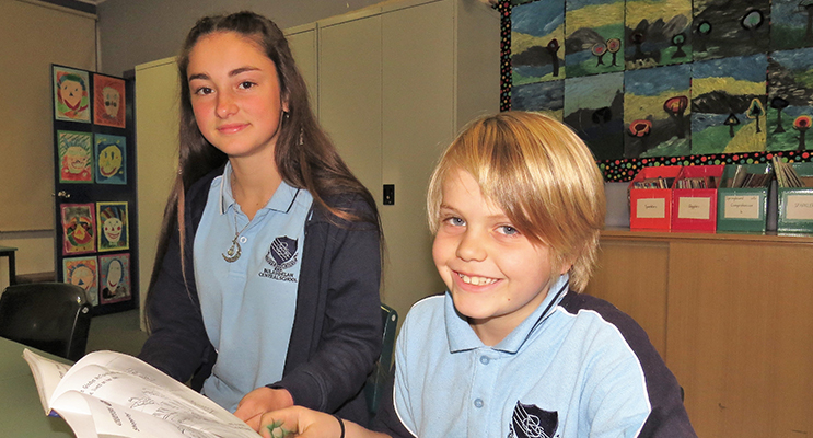Learning Together: Year 9 student Katerina Poniris reading with Henry O’Connell.