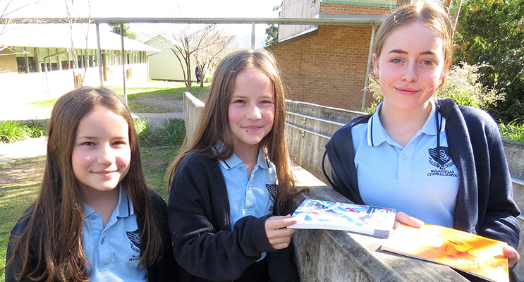 We Learn: Year 7 students Jazmin and Jessica Moseley with Olivia Magee-Scannell from Year 9.   