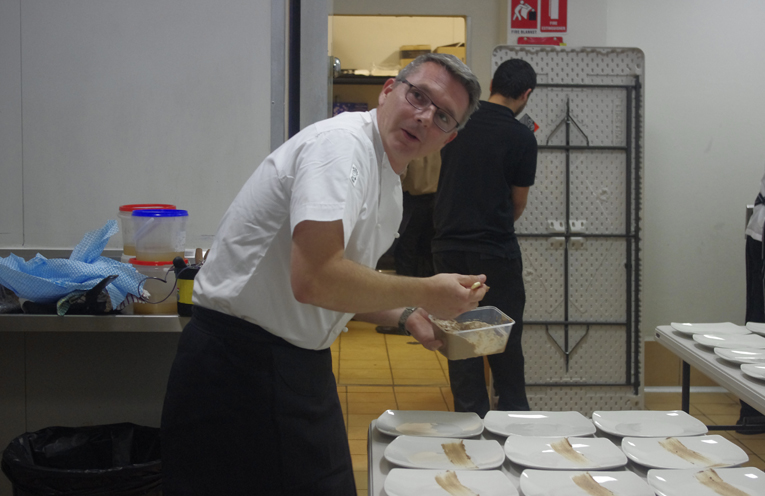 Chef Ludovic Poyer plating up the entree. Photos by Marian Sampson