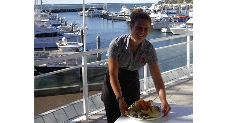Isabel Redhead serves up a delicious meal on the deck at Rock Lobster Restaurant.  Photo by Marian Sampson