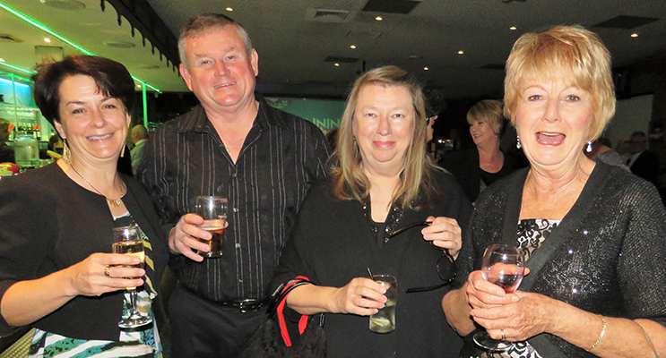 Theresa and David Mort, Karen Carran and Jane Carryer enjoy a pre-dinner drink.