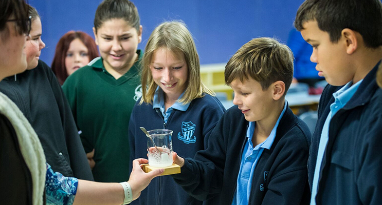 Science Lesson: Georgia Murray from Bungwahl and Tea Gardens students Kallen Craft, Jye Trace and Tye Carter experiment with BCS teacher Mrs Mel Legge. Photo: BCS