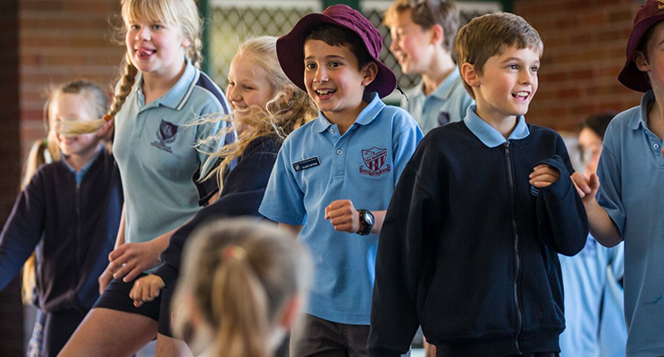 Dancing To The Beat: Bulahdelah and Tea Gardens Year 6 students get into the swing during the lunchtime concert. Photo BCS