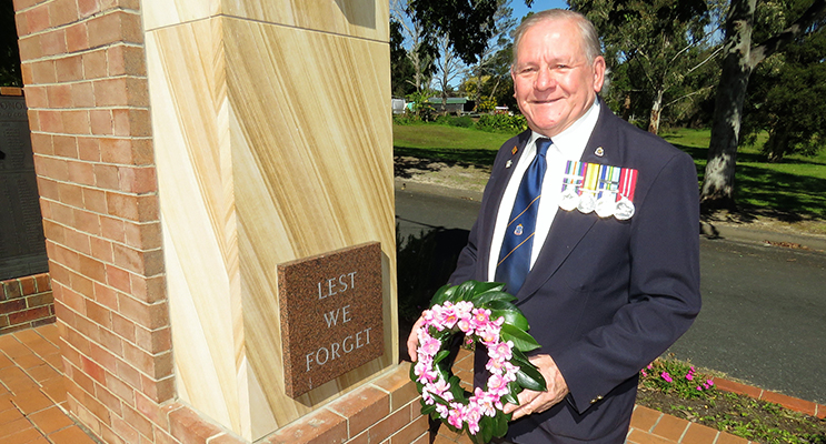 A Time To Remember: Veteran Peter Millen lays a wreath in remembrance of the lives lost and sacrifices made. 