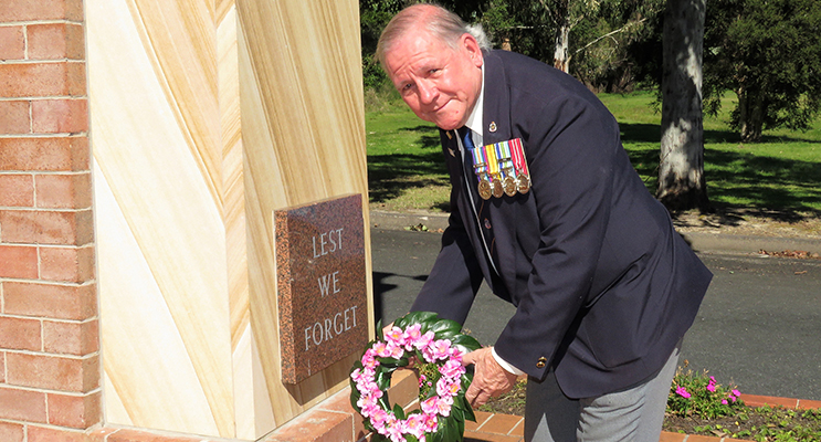 Vietnam Veteran, Peter Millen, lays a wreath in remembrance. 