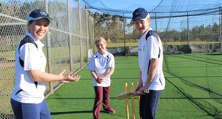 Cricketers Lillee Banks, 11, Chelsea Brealey, 10 and Aili Martin, 12, in the practice nets.