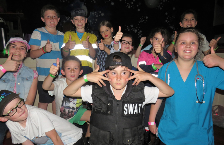 Kids give the Blue Light disco the thumbs up. 