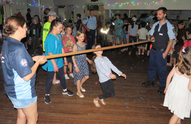 Limbo with Senior Constable Dave Feeney and committee member Aleesha Ray.