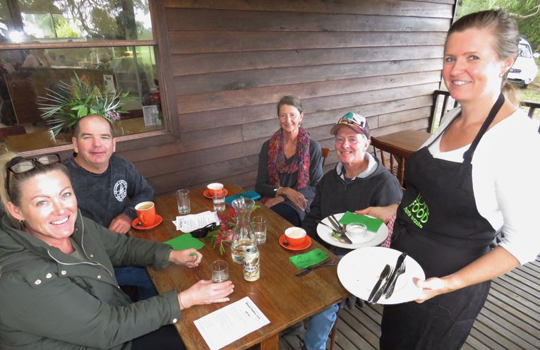Cafe Volunteer Megan Griffiths serves Sandy and Ricky Woods and Helen and Allen Gorman.