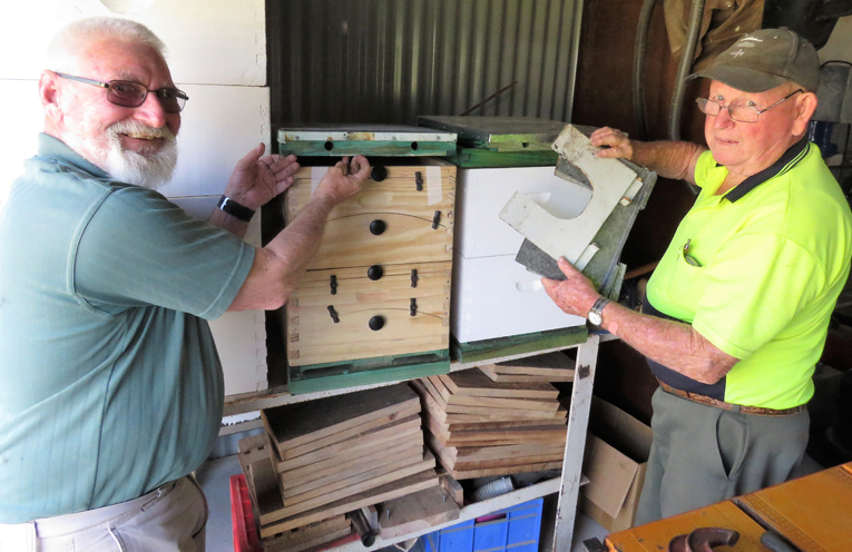Steve Newman and John Renfrew working on the bee boxes.