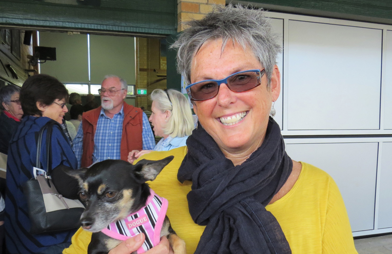 Liz McKay arrived to cast her vote in Tea Gardens with her dog Bella.