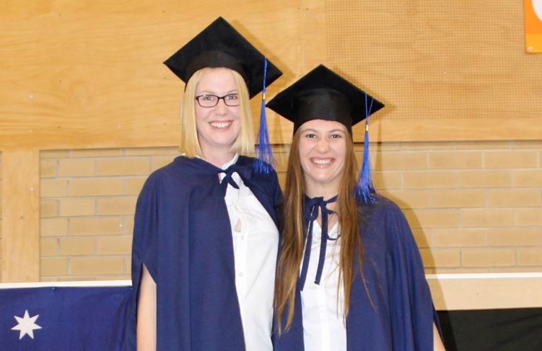 Kaitlyn Gregory and Tamara Gooch receive the Mid-Coast Connect Awards .