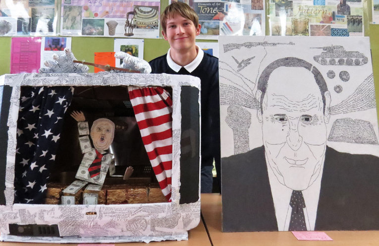 Darcy Harris with his political sculpture and caricature portrait. 