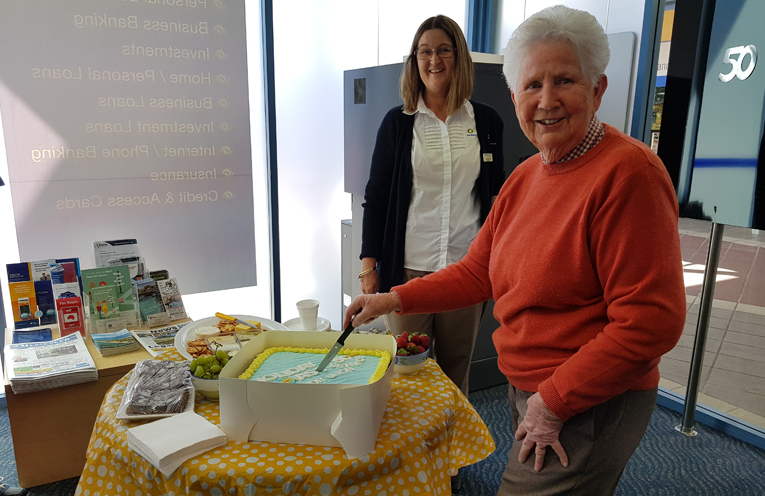 50th ANNIVERSARY: Member Ann Browning cuts the cake.