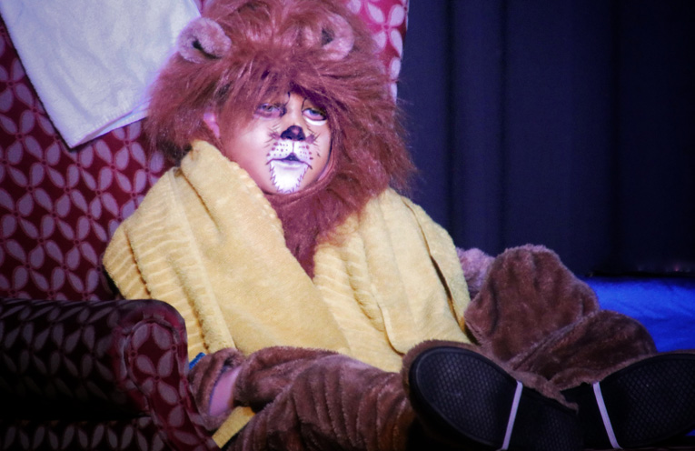 Charlie McGrath as the Vegetarian Lion.