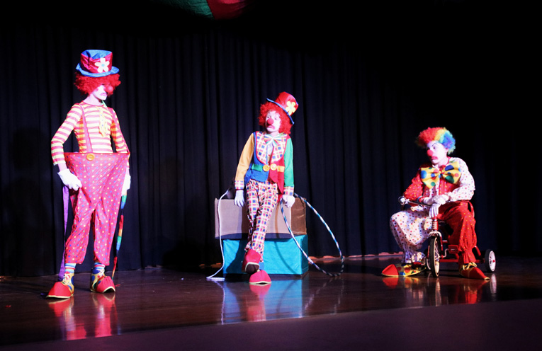 Clowns on stage Rowan Connick, Joshua Carpenter and Benjamin Carpenter. 