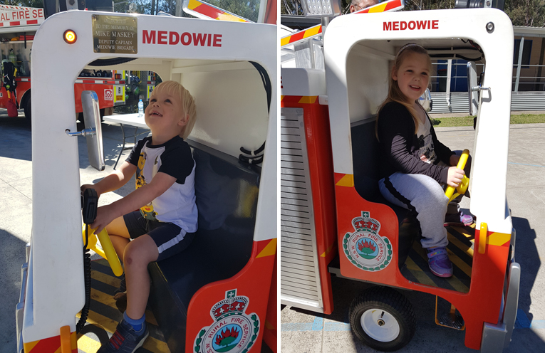 Oscar, 3 years old, is very excited about the Fire Brigade’s replica fire truck. (left) Hunter, 6 years old learning about Mike the replica fire truck. (right)