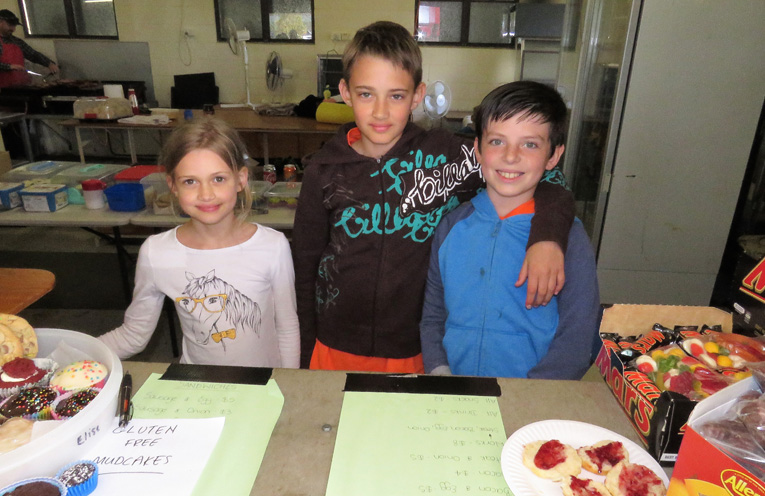 Service With A Smile: Salome Rietsma, Nathaniel Rietsma and Aiden Miles serve in the canteen.