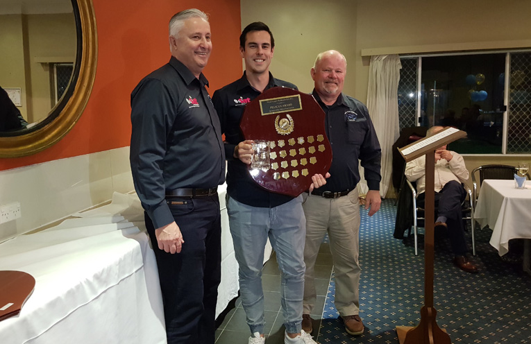 PELICAN AWARD: Coach Russell Gunn, Danny Lawrence and President David Bright.
