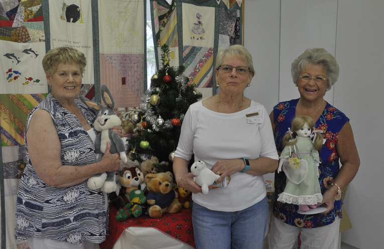 SALVATION ARMY CHRISTMAS APPEAL: Annette Naylor, Jenny Love and Di Taylor admiring gifts.
