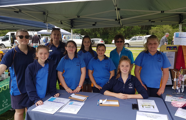 Medowie girl guides selling tickets at the markets in Medowie. 
