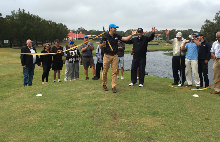 Mayor Ryan Palmer cutting the ribbon as he opens the new ninth hole at Horizons Golf Resort. Photo by Marian Sampson