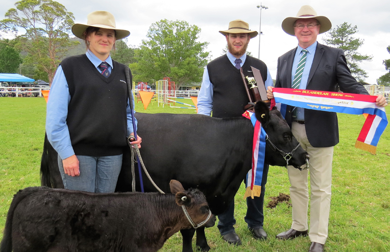 Grand Champion Small Breeds Female: ‘Lilly of the Valley’ and three-week-old calf, Katherine and Lachlan Williams from Lach Lans Lowline Stud and Myall Lakes MP Stephen Bromhead. 