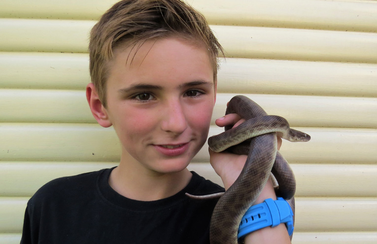 Camran Bailey and his pet snake Tootsie. 