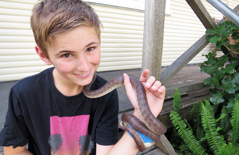 Camran Bailey and his pet snake Tootsie. 